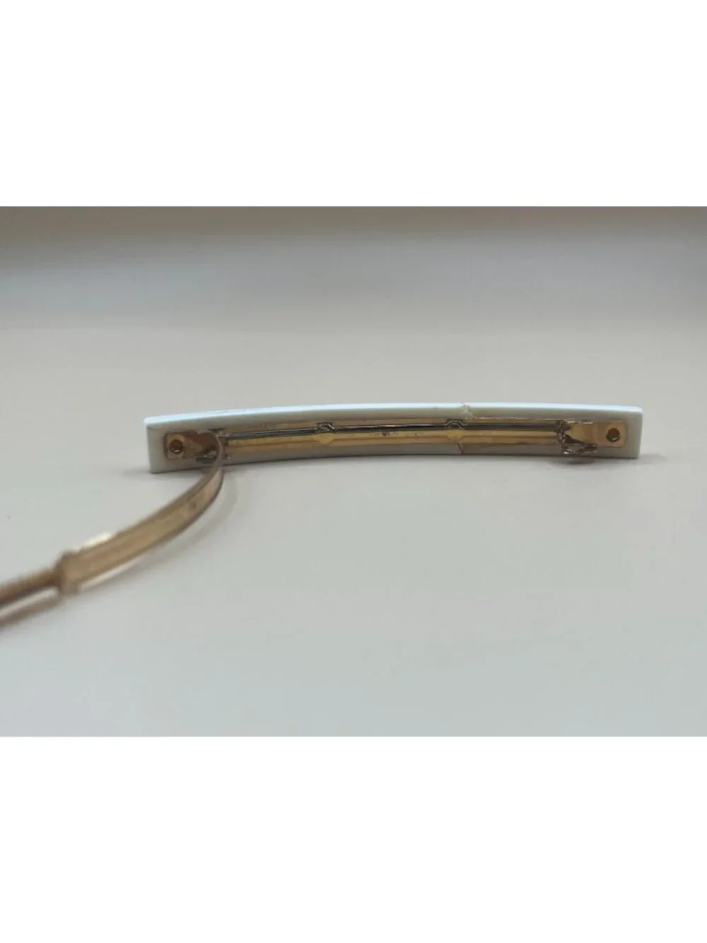 Authentic vintage Chanel bar barrette in cream-white resin, printed with two red